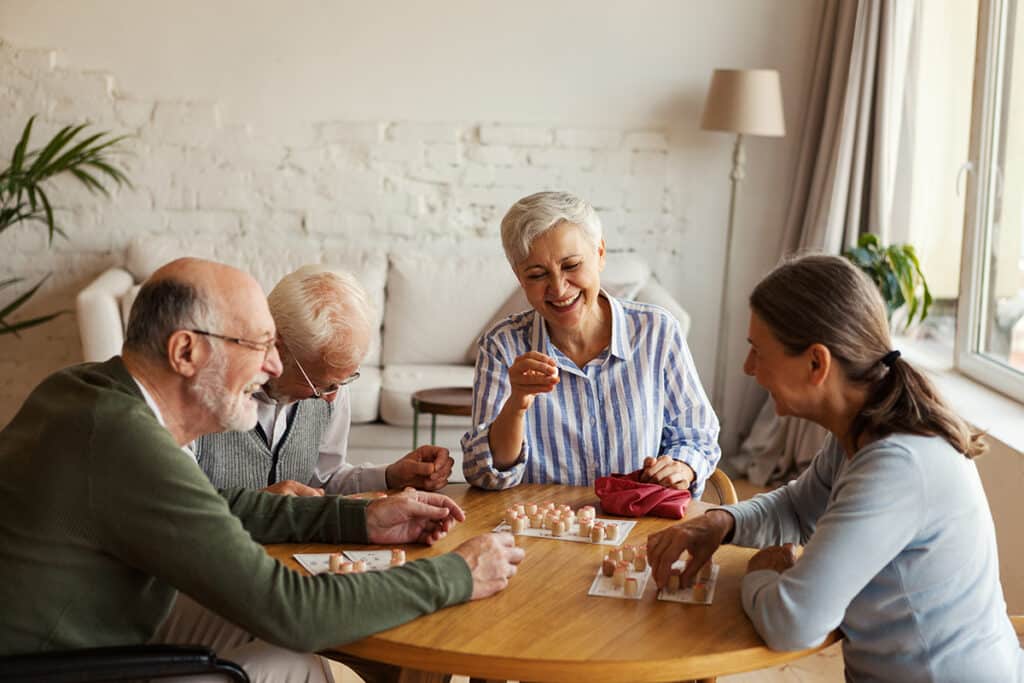 Tiburon Hills Care Center residents smiling and playing a game